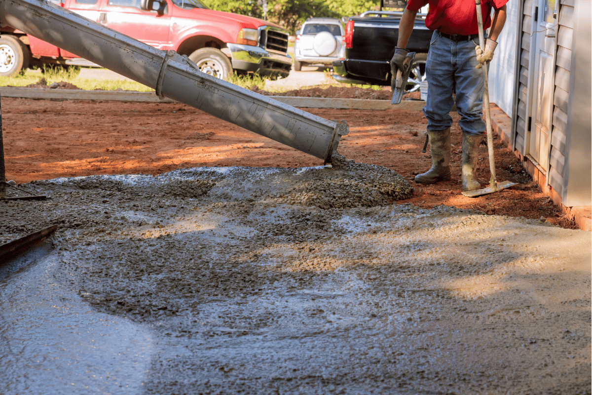 contractor pouring concrete driveway