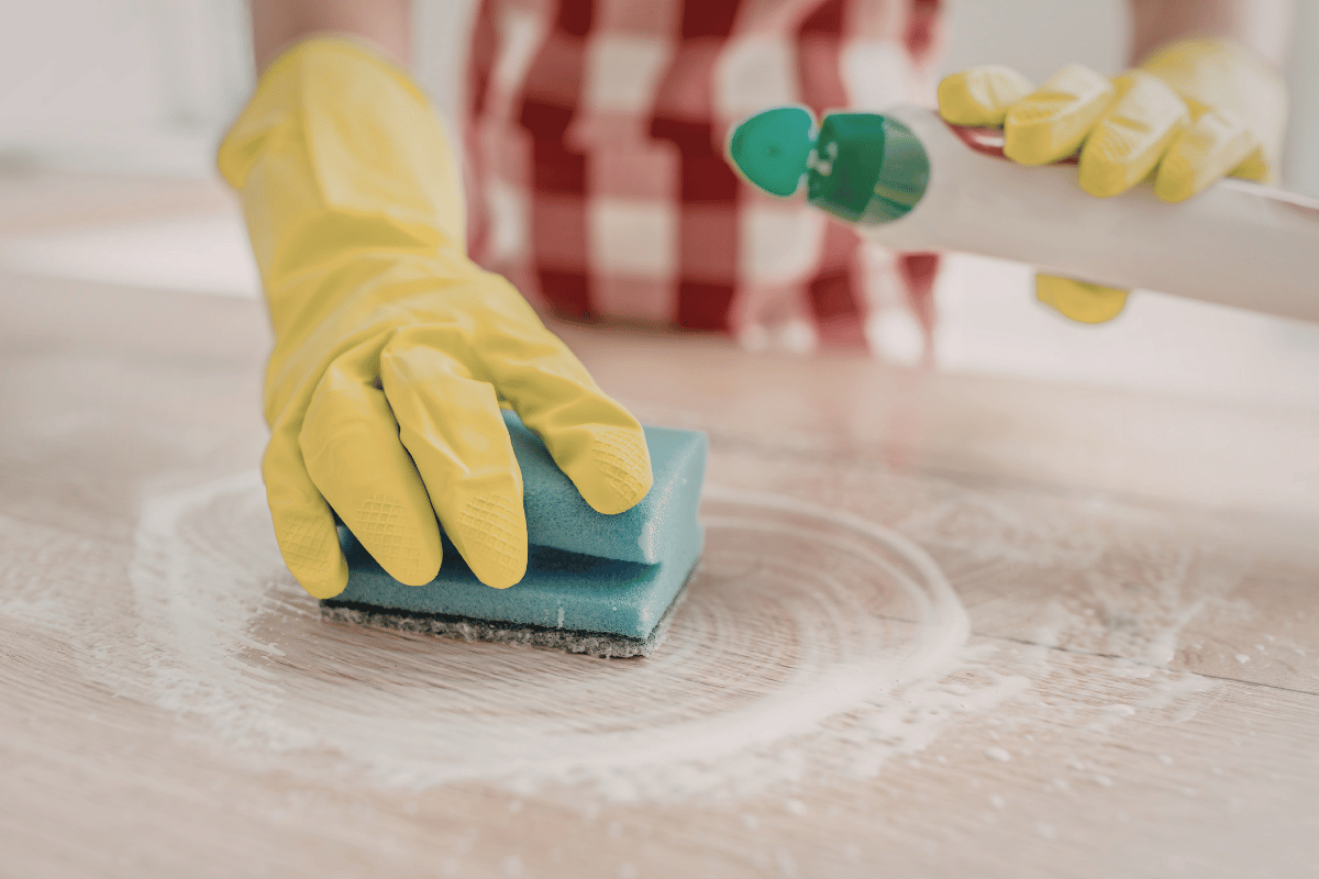 cleaning wall with sponge gloves